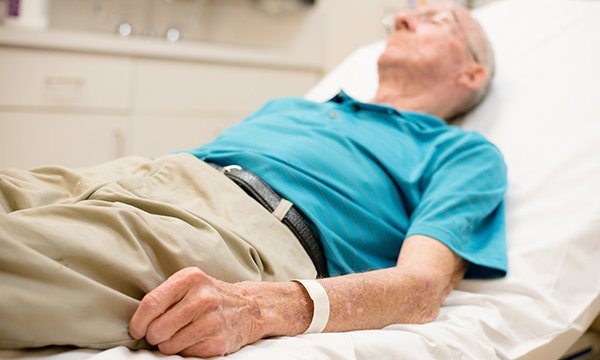 Frail Older Man Lying On Bed Older People With Frailty Tend To Present Late And Often In Crisis